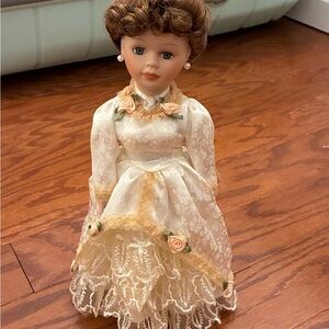 Elegant Porcelain Doll with Lace Dress